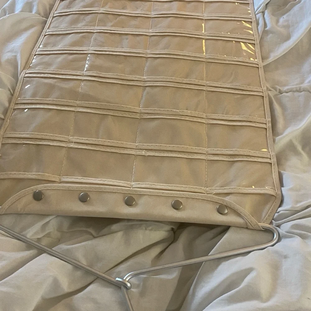 Hanging organizer, never used. Plastic inserts, canvas base.
